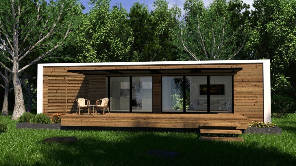 Ein Einfamilienhaus in Holzbauart auf einer grünen Wiese