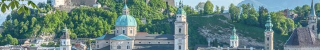 Blick auf Reihenhäuser und diverse Gebäude in Salzburg: Kapitalanlagen