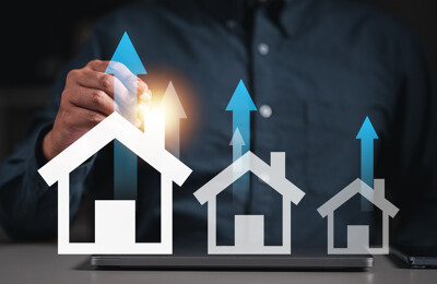 Häuser mit Pfeilen, die nach oben zeigen