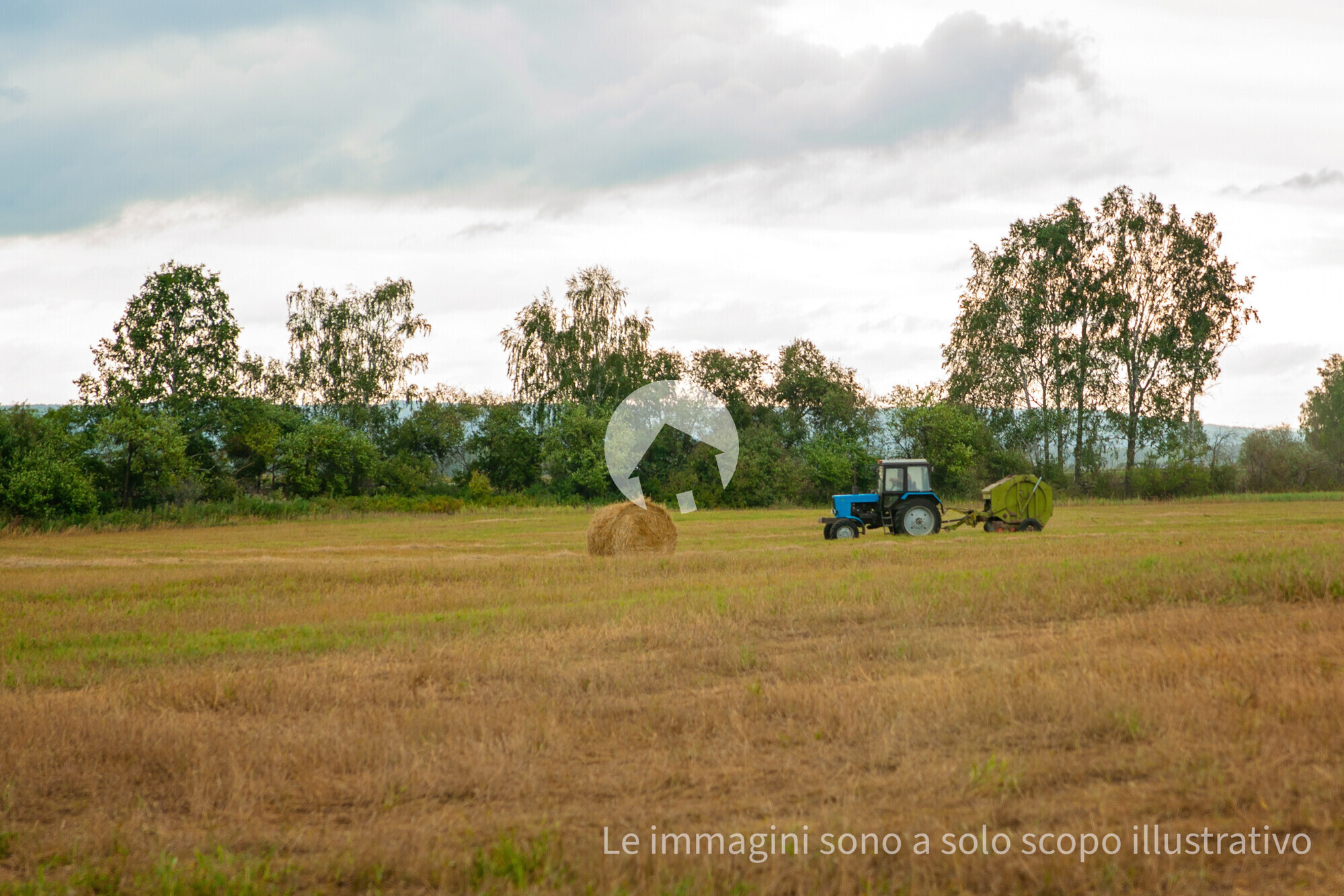 a-tractor-is-driving-across-the-field-mowing-the-2025-02-10-14-39-25-utc