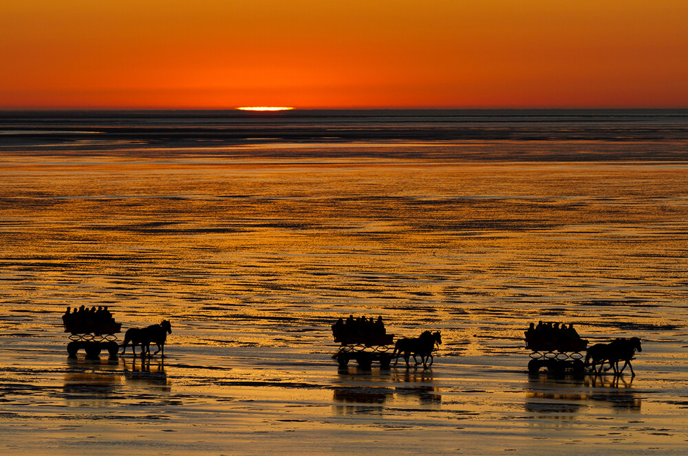 Wattwagen im Sonnenuntergang