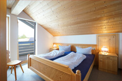 Schlafzimmer mit Balkonzugang