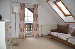 Gästezimmer mit Terrasse und Seeblick