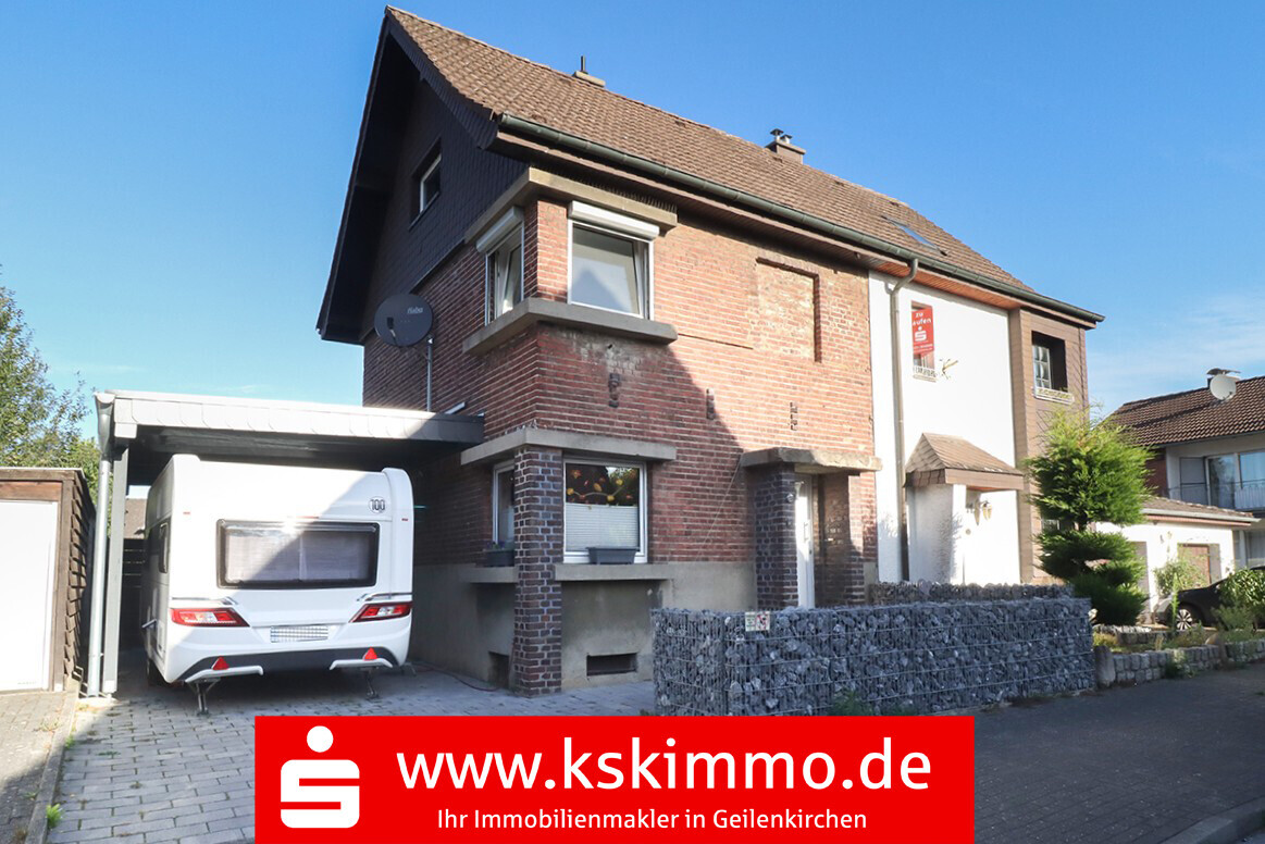 Immobilienmakler - Geilenkirchen: Doppelhaushälfte mit Carport und Garten 