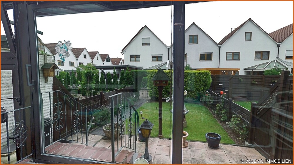 Wintergarten mit Gartenblick
