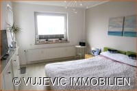 Schlafzimmer mit Balkonzugang