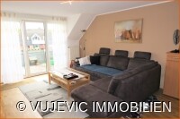 Wohnzimmer mit Balkonzugang