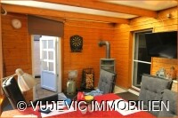 Wintergarten mit Kaminofen