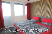 Schlafzimmer mit Balkonzugang