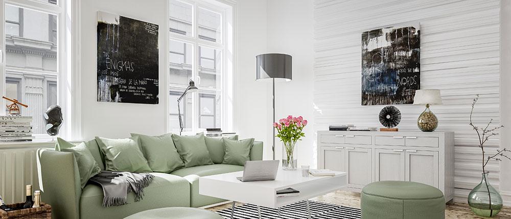 Weißes, modernes Wohnzimmer mit grüner Couch.