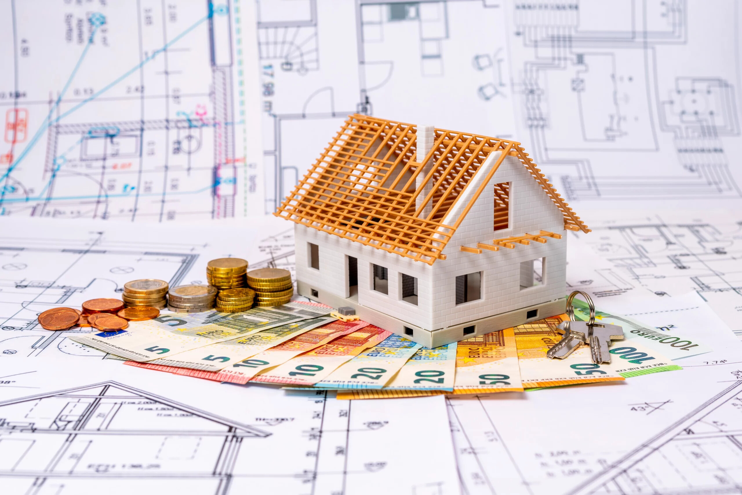 Modellhaus mit Geldscheinen