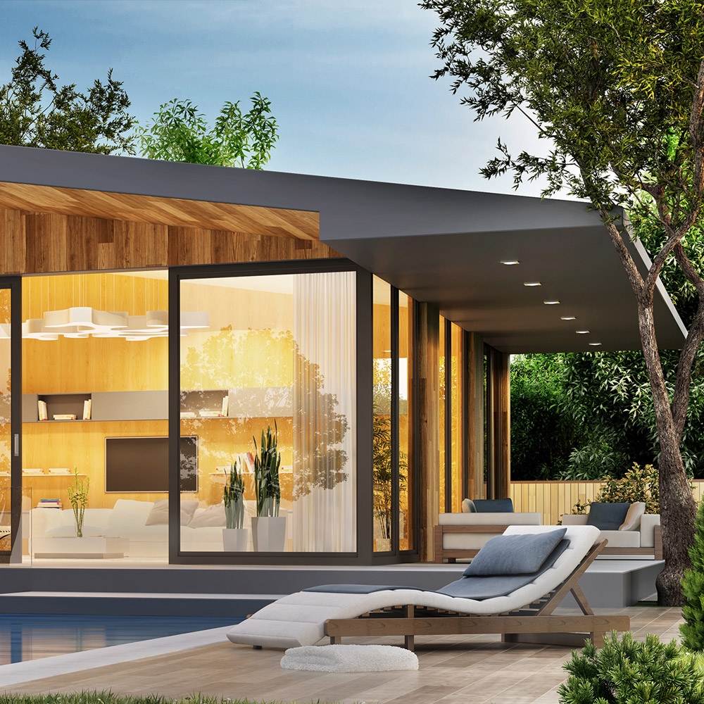 Villa mit Innenbeleuchtung und Liege am Pool