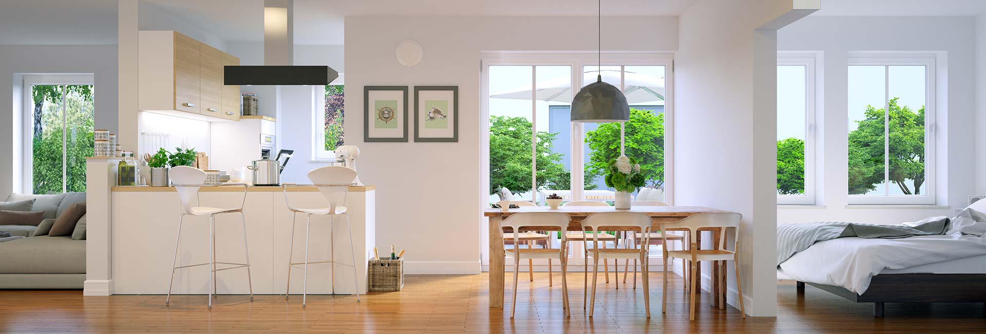 Wohnbereich mit Küche, Esstisch, Bett, großen Fenstern und Grün.