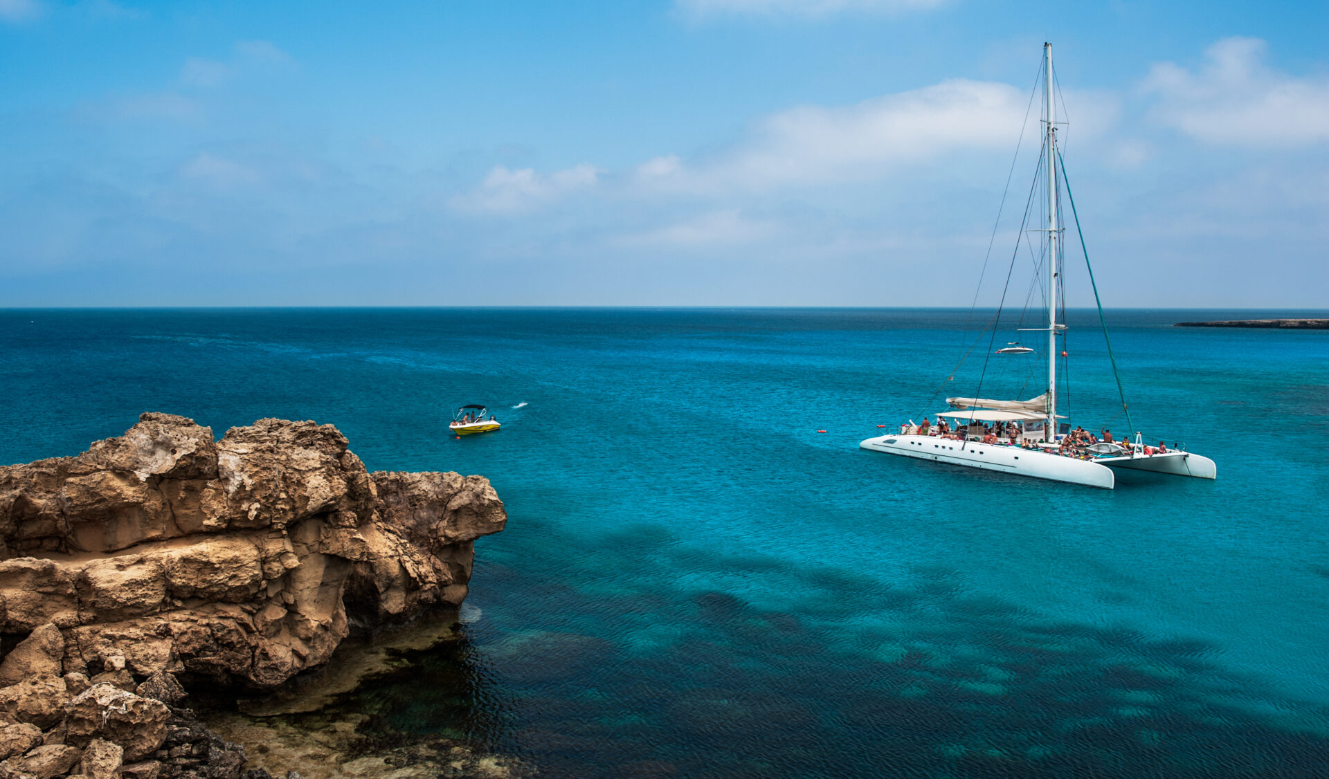 Holiday at the Mediterranean sea. Clean sea water. Beautiful coastline. Blue lagoon. European resort. Cruise travel in Europe. Eurotrip. Cruise tour. Yacht at sea. Trip abroad