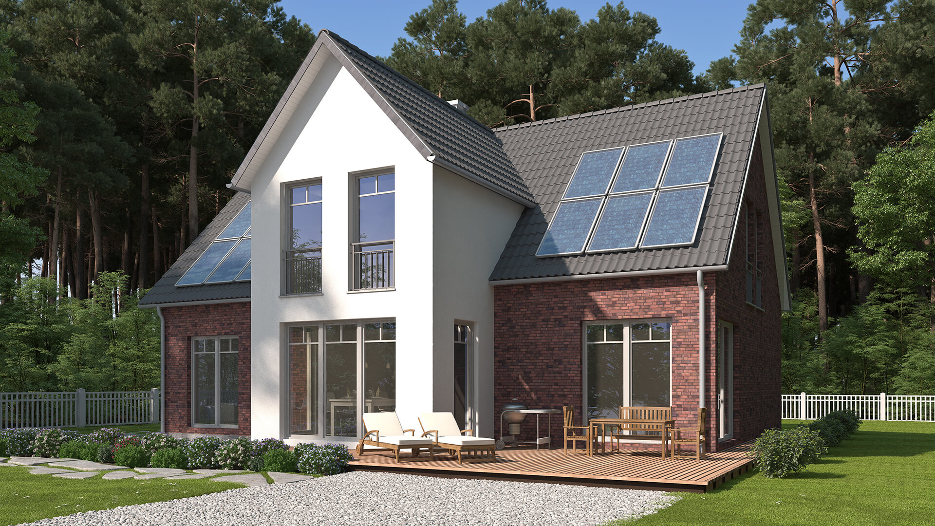 Haus mit Solarpanels, großen Fenstern und Terrasse im Grünen