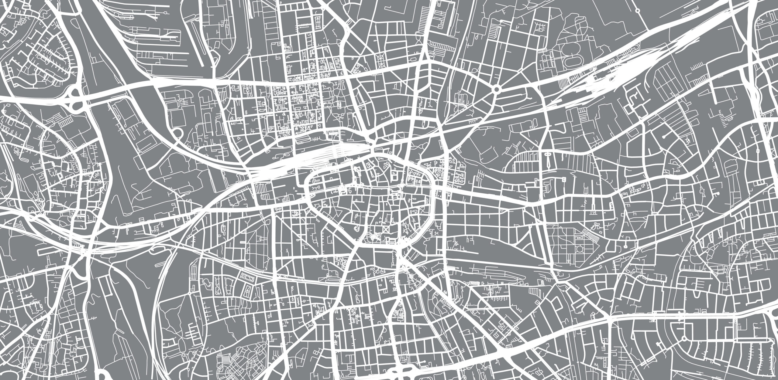 Grau-weißer Stadtplan mit Straßen und Kreuzungen, unbeschriftet.