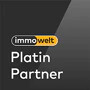 Logo von Immowelt mit dem Text 'Platin Partner' auf schwarzem Hintergrund