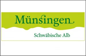 Grünes Schild mit dem Schriftzug 'Münsingen Schwäbische Alb'