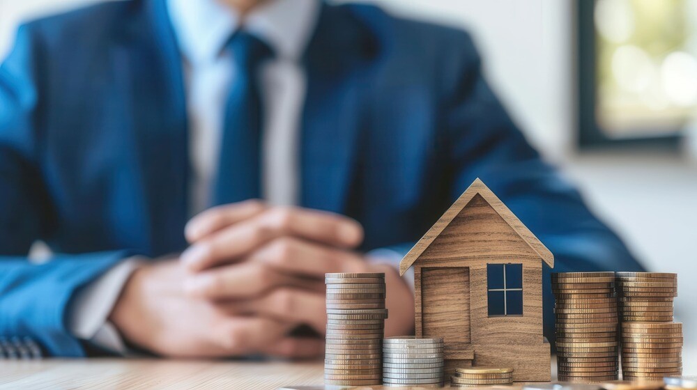 Münzen und Modellhaus