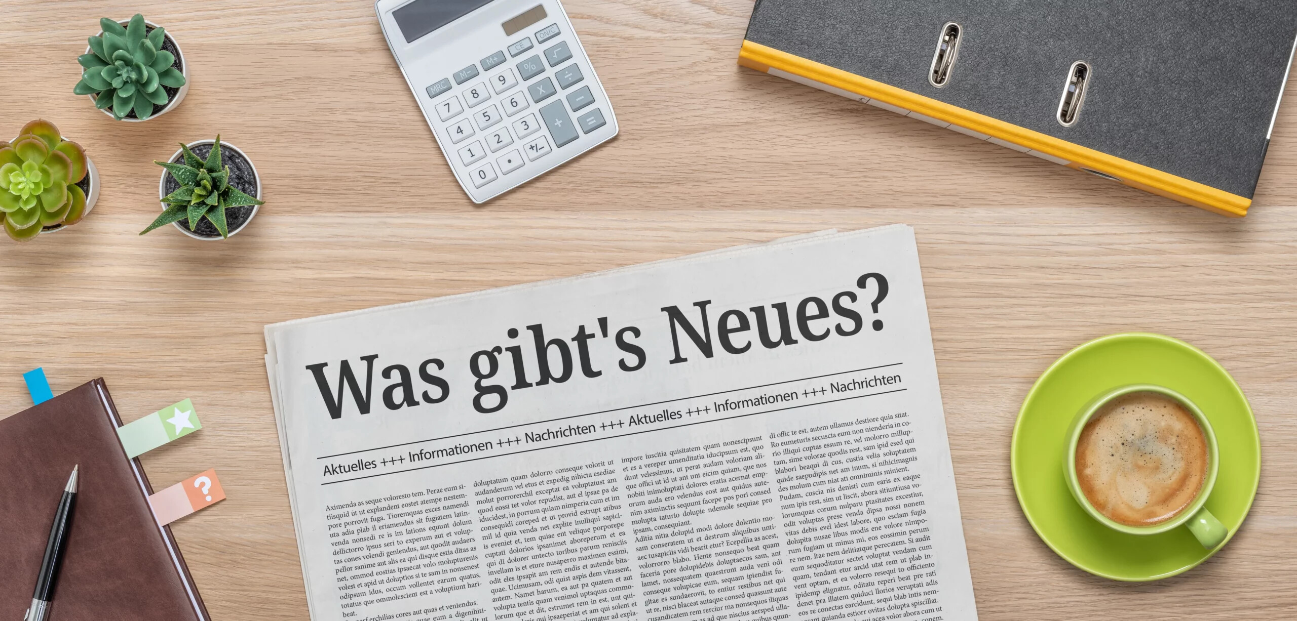 Zeitung mit der Schlagzeile "Was gibt's Neues?"