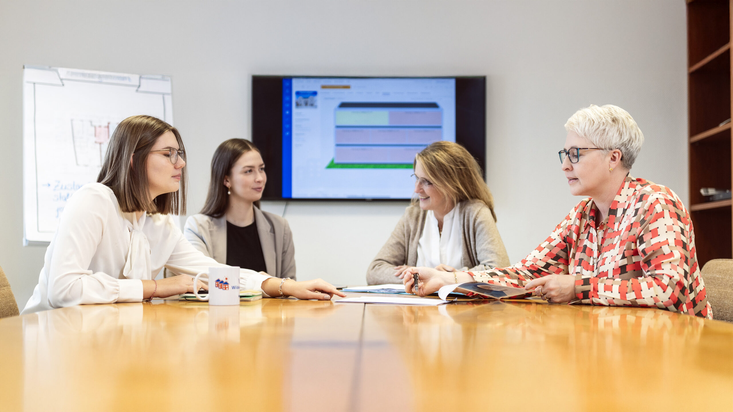 Vier Mitarbeiter der VR-Immobilien Wildeshauser Geest GmbH