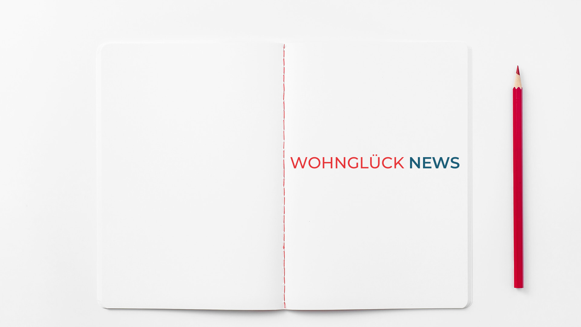 Notizbuch mit dem Schriftzug Wohnglück News