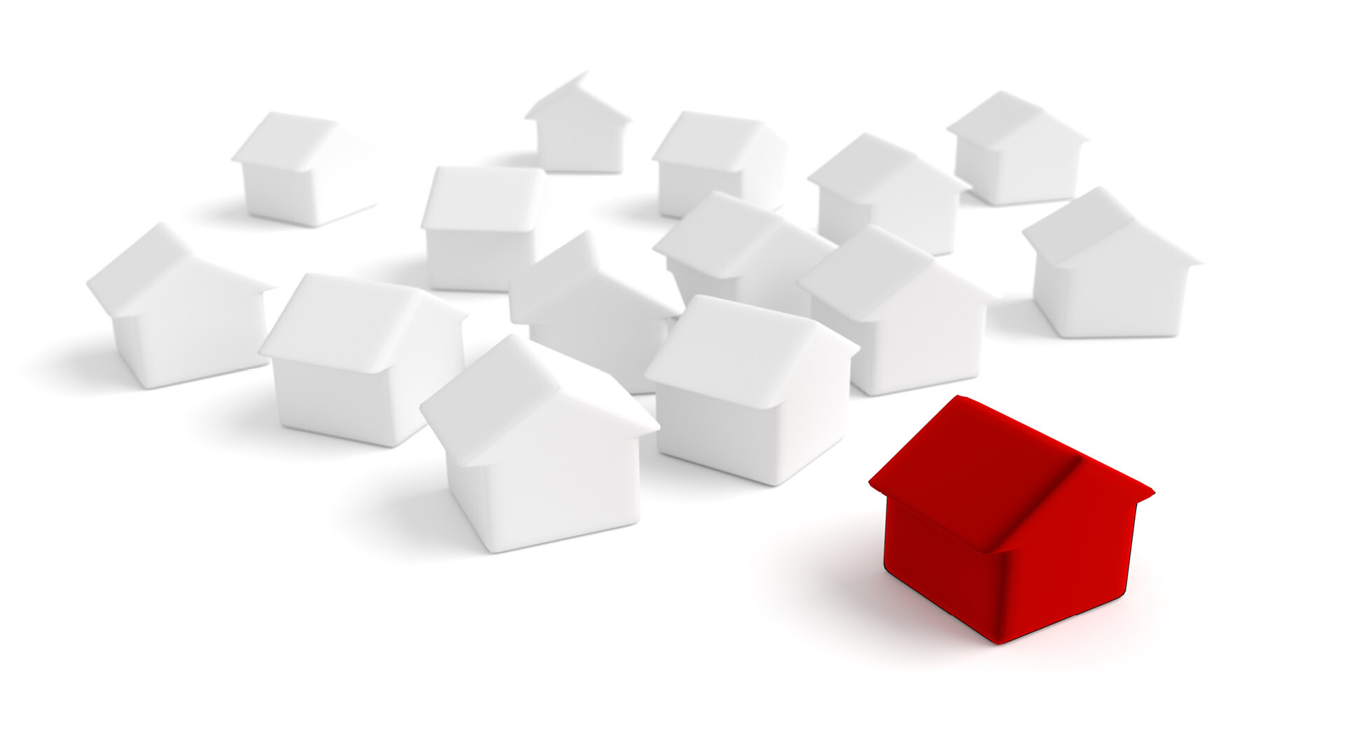 Rotes Modellhaus unter vielen weißen