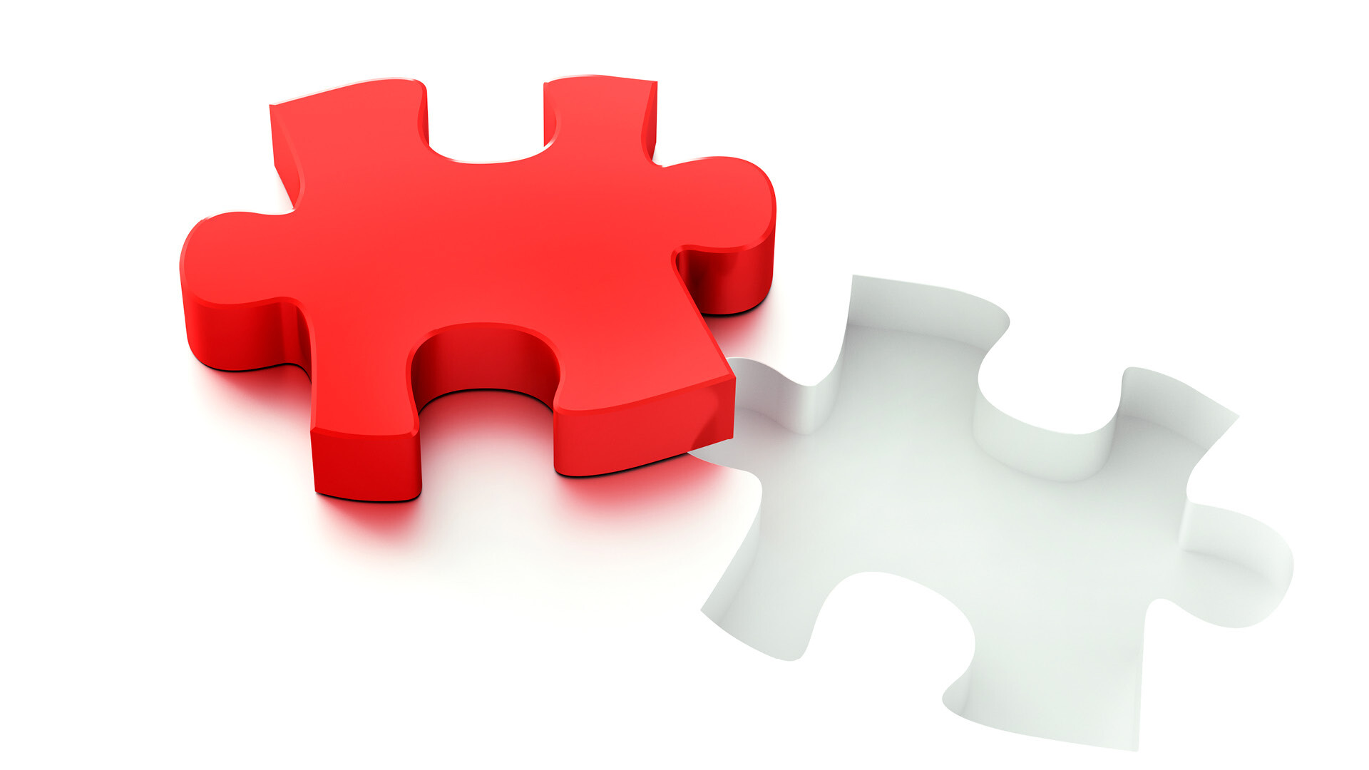 Rotes Puzzleteil auf weißem Hintergrund