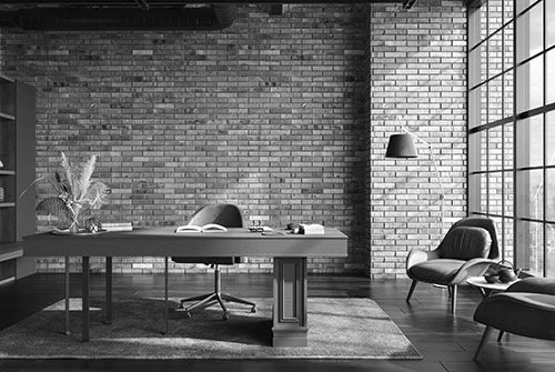 Modernes Einzelbüro mit großem Tisch und braunen Sesseln